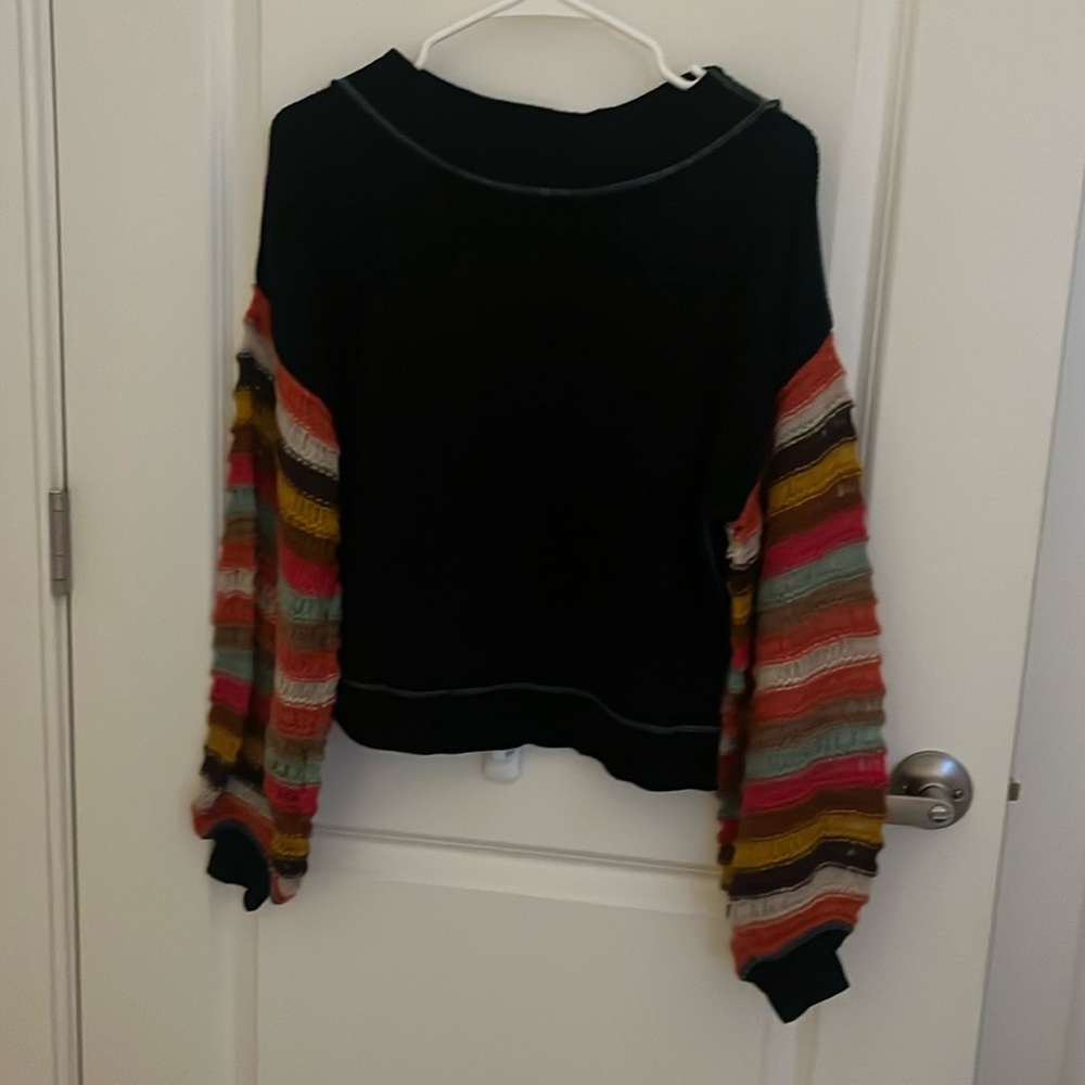 We The Free - Black comfy ribbed sweater with colorful sleeves.